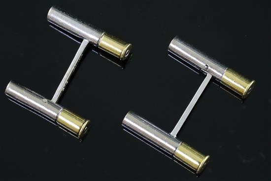A matched pair of Cartier two colour 18ct gold shotgun cartridge cufflinks, 21mm.